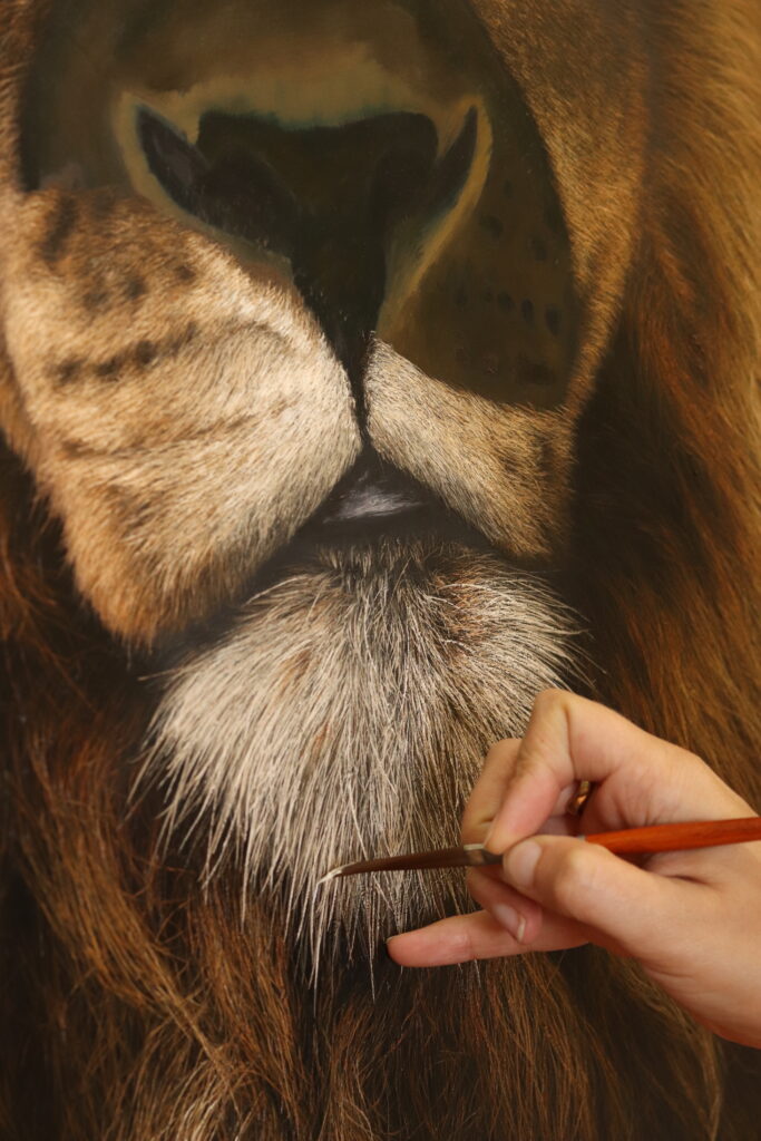 Close up of the artist working on the chin